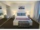 Relaxing bedroom with a queen bed and ample light at 200 N Bruce St # A, Las Vegas, NV 89101