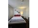 Simple bedroom with a full-size bed and desk at 200 N Bruce St # A, Las Vegas, NV 89101
