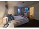 Spacious bedroom with a large bed, nightstands, and a dresser at 200 N Bruce St # A, Las Vegas, NV 89101