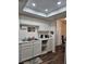 Well-lit kitchen with white cabinets and a double sink at 200 N Bruce St # A, Las Vegas, NV 89101
