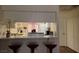 Kitchen with breakfast bar and three red bar stools at 200 N Bruce St # A, Las Vegas, NV 89101