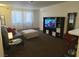 Spacious living room with TV stand and comfy seating at 200 N Bruce St # A, Las Vegas, NV 89101