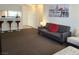 Cozy living room featuring a gray couch and an accent chair at 200 N Bruce St # A, Las Vegas, NV 89101