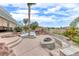 Landscaped backyard with pool, fire pit and seating at 2049 Troon Dr, Henderson, NV 89074
