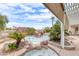 Relaxing backyard oasis featuring a unique rock pool and pergola at 2049 Troon Dr, Henderson, NV 89074