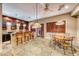 Wet bar with seating and custom cabinetry at 2049 Troon Dr, Henderson, NV 89074
