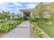Beautiful two-story home with landscaped entry and walkway at 2049 Troon Dr, Henderson, NV 89074