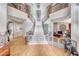 Grand two-story entry with curved staircase and hardwood floors at 2049 Troon Dr, Henderson, NV 89074