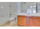 Bathroom with toilet, shower/tub combo, and wood vanity at 2110 Los Feliz St # 1046, Las Vegas, NV 89156