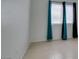Spacious bedroom with tile floors and window with blinds at 2110 Los Feliz St # 1046, Las Vegas, NV 89156