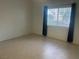 Bright bedroom with large window and tile floors at 2110 Los Feliz St # 1046, Las Vegas, NV 89156