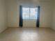 Spacious bedroom with large window and tile floors at 2110 Los Feliz St # 1046, Las Vegas, NV 89156