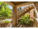 Covered patio with stairs and green landscaping at 2110 Los Feliz St # 1046, Las Vegas, NV 89156