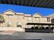 Tan two-story building with parking and mountain views at 2110 Los Feliz St # 1046, Las Vegas, NV 89156