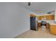 Kitchen with wood cabinets, stainless steel appliances, and tile floor at 2110 Los Feliz St # 1046, Las Vegas, NV 89156