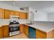 Kitchen features stainless steel appliances and teal dishwasher at 2110 Los Feliz St # 1046, Las Vegas, NV 89156
