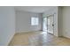Living room with tile floors, sliding door and window at 2110 Los Feliz St # 1046, Las Vegas, NV 89156
