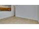 Bright living room with tile floors, kitchen access, and ceiling fan at 2110 Los Feliz St # 1046, Las Vegas, NV 89156