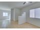 Bright living room with tile floors and partial wall at 2110 Los Feliz St # 1046, Las Vegas, NV 89156
