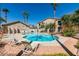 Inviting community pool with lounge chairs and landscaping at 2110 Los Feliz St # 1046, Las Vegas, NV 89156