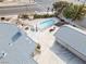 Aerial view of the property featuring the pool, spacious driveway, and mature landscaping at 2327 River City Dr, Laughlin, NV 89029