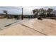 The backyard features a pool, concrete patio, and lovely desert landscape views at 2327 River City Dr, Laughlin, NV 89029