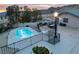 Backyard view showcasing a private pool and outdoor dining area with mountain views at 2327 River City Dr, Laughlin, NV 89029