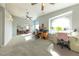 Large bonus room with multiple ceiling fans, computers and work spaces at 2327 River City Dr, Laughlin, NV 89029