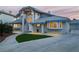 Charming home boasts a well-manicured lawn, tiled roof, and inviting entrance, enhancing its curb appeal at 2327 River City Dr, Laughlin, NV 89029