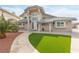 Charming home boasts a well-manicured lawn, tiled roof, and inviting entrance, enhancing its curb appeal at 2327 River City Dr, Laughlin, NV 89029
