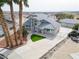 Aerial view of home featuring desert landscaping, driveway, tile roof, and a private gated entrance at 2327 River City Dr, Laughlin, NV 89029