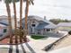 Aerial view showcases the home and the yard with lush palm trees enhancing curb appeal at 2327 River City Dr, Laughlin, NV 89029