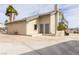 Home featuring a spacious concrete driveway with a two-story design, complemented by desert landscaping and stucco exterior at 2327 River City Dr, Laughlin, NV 89029