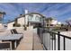 Exterior view showcasing the backyard patio, landscaping and wrought iron fence detail at 2327 River City Dr, Laughlin, NV 89029