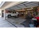 Spacious three-car garage features ample storage, tools, and a white truck at 2327 River City Dr, Laughlin, NV 89029