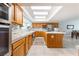 Bright kitchen with stainless steel appliances, light wood cabinets, ample counter space, and natural light at 2327 River City Dr, Laughlin, NV 89029