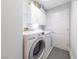 Laundry room features a full-size washer and dryer with storage cabinets at 2327 River City Dr, Laughlin, NV 89029