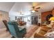 Open concept living room with fireplace, access to backyard, comfortable seating, and tile flooring at 2327 River City Dr, Laughlin, NV 89029