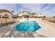 View of the in-ground pool with desert landscaping and well-maintained backyard at 2327 River City Dr, Laughlin, NV 89029