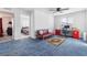 Spacious secondary bedroom, a futon, a work station, and blue carpet at 3558 Herodain Ave, Las Vegas, NV 89106