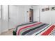 Neutral bedroom featuring a striped bedspread and closet with sliding doors at 3558 Herodain Ave, Las Vegas, NV 89106