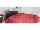 Bedroom featuring a red comforter, dresser, and white trim accents at 3558 Herodain Ave, Las Vegas, NV 89106