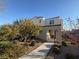 Charming two-story home with desert landscaping and a welcoming walkway at 3558 Herodain Ave, Las Vegas, NV 89106