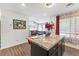Open-concept kitchen with a granite island and seamless flow into the living area at 3558 Herodain Ave, Las Vegas, NV 89106