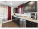Bright kitchen featuring granite countertops, stainless steel appliances, and ample counter space at 3558 Herodain Ave, Las Vegas, NV 89106