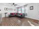 Bright living room with hardwood floors, a leather sofa, and neutral decor at 3558 Herodain Ave, Las Vegas, NV 89106