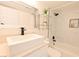 Well-lit bathroom featuring a vessel sink, modern black hardware, a shower-tub, and a mirrored vanity at 4193 W Warm Springs Rd, Las Vegas, NV 89118
