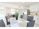 Bright dining area with stylish seating next to the kitchen, boasting stainless steel appliances at 4193 W Warm Springs Rd, Las Vegas, NV 89118