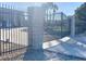 Entrance gate with brick pillars and decorative metal work at 4193 W Warm Springs Rd, Las Vegas, NV 89118