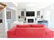 Bright living room features a fireplace with brick surround and contemporary furnishings at 4193 W Warm Springs Rd, Las Vegas, NV 89118